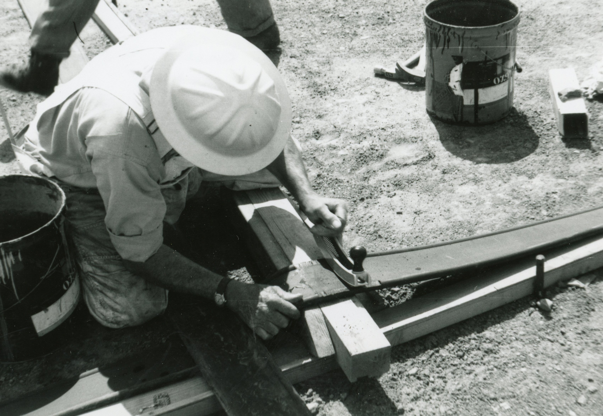 Columbine Historical Image 3 - black and white photo of a workers cutting material