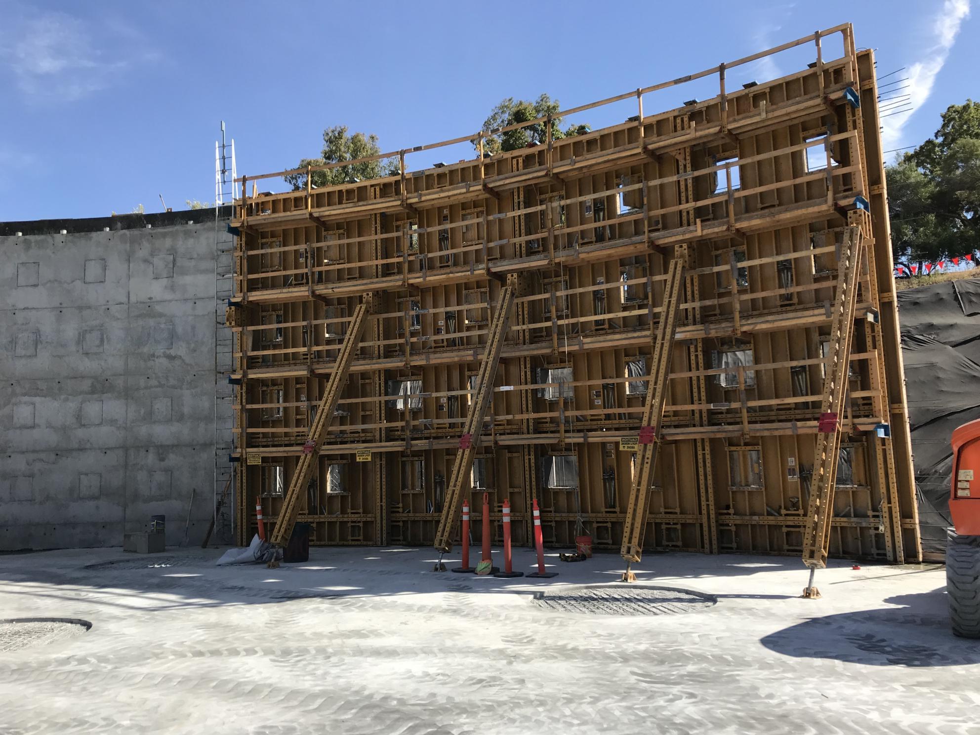 wooden frames of tank walls adjacent to already poured concrete walls